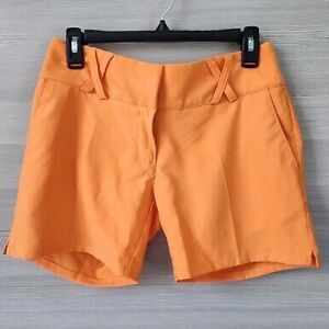 Adidas Orange Climalite shorts. Size 4.  NWOT